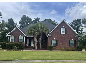 Charming brick home with well-manicured lawn and lush landscaping at 112 Amanda Cir, Goose Creek, SC 29445