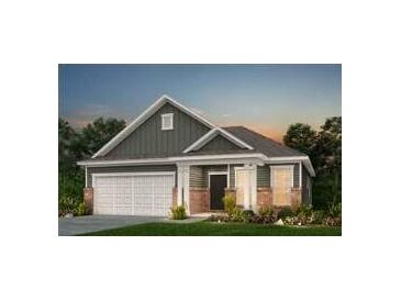 Charming single-story home with brick accents, a two-car garage, and a well-maintained front lawn at 117 Royal Cainhoy Way, Huger, SC 29450