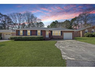 Charming brick ranch with a well-manicured lawn, attached garage, and inviting front entrance at 1264 Fort Dr, Hanahan, SC 29410