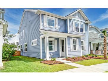 Charming two-story home with blue siding, white trim, and a well-manicured front yard at 131 Brant Dr, Summerville, SC 29483