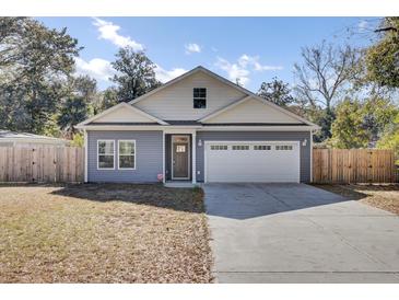 Charming single-Gathering home with a two-car garage and well-maintained front yard at 409 Klein St, Walterboro, SC 29488