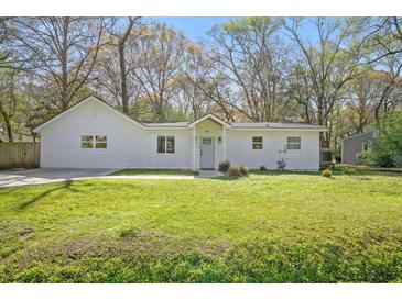 Charming single story home with a well manicured lawn and mature trees at 914 King Richard Dr, Charleston, SC 29407