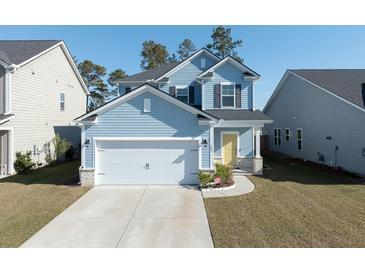 Charming two-story blue home featuring an attached garage, yellow front door, and well-maintained landscaping at 103 Cotesworth Ct, Summerville, SC 29486