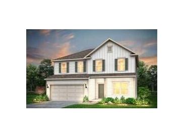 Charming two-story home features a symmetrical facade, a two-car garage, and professionally landscaped front yard at 123 Royal Cainhoy Way, Huger, SC 29450