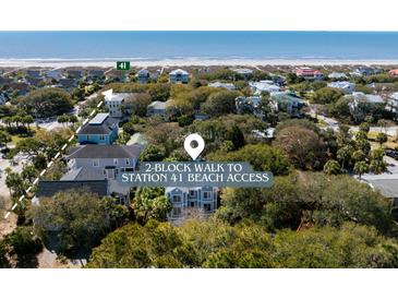 An aerial view shows a neighborhood of beach homes with a marked walking path to beach access, plus ocean views at 4006 Hartnett Blvd, Isle of Palms, SC 29451