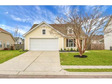 Charming single-Gathering home with manicured lawn and two car garage in a suburban neighborhood at 7120 Sweetgrass Blvd, Hanahan, SC 29410