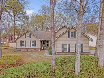 Charming home with well-maintained landscaping, inviting curb appeal, and traditional architectural details at 101 Plantation Dr, Summerville, SC 29485
