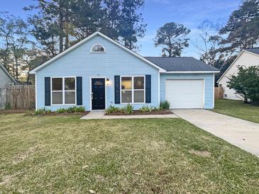 Charming light blue single-story home with black shutters and a well-maintained front lawn at 117 Coronet St, Summerville, SC 29483