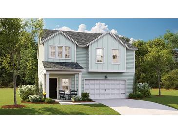 Charming two-story home with light blue siding, a front porch with rocking chairs, and a well-manicured lawn at 123 Moscato Ln, Summerville, SC 29485
