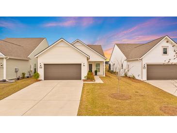 Charming single-Gathering home with a two-car garage and a well-maintained front yard under a beautiful sunset at 178 Garden Gate Way, Summerville, SC 29486