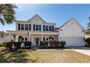 Charming two-story home with a covered front porch and manicured landscaping at 2052 Bancroft Ln, Mount Pleasant, SC 29466