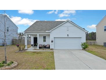 Charming single-Gathering home with a white exterior, attached garage, and well-maintained lawn and landscaped yard at 429 Pender Woods Dr, Summerville, SC 29486