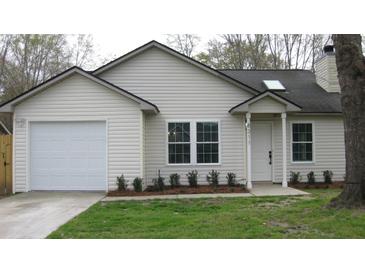 Charming single-story home with a well-maintained lawn, a one car garage, and vinyl siding at 8311 Whitehaven Dr, North Charleston, SC 29420