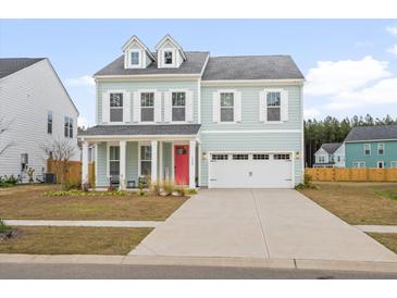Charming two-story home with a bright red door and dormer windows at 1420 Homecoming Blvd, Ravenel, SC 29470