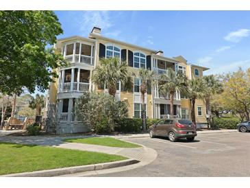 Inviting multi-story condo building with charming balconies and beautiful palm trees at 1522 Telfair Way, Charleston, SC 29412