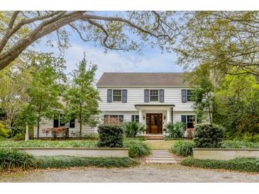 Stunning two-story home with manicured front yard and mature trees at 7 Guerard Rd, Charleston, SC 29407