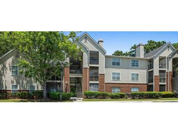 Attractive multi-story condo building with brick accents and mature landscaping at 2011 N Highway 17 # 1100I, Mount Pleasant, SC 29466