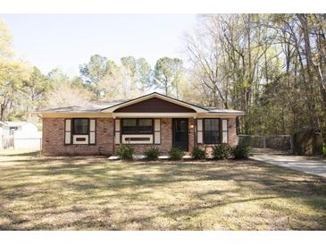 Charming brick home with a well-maintained lawn and traditional design at 208 Owens Dr, Summerville, SC 29485