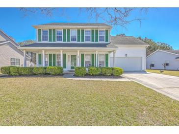 Charming two-story home with green shutters and a well-manicured lawn at 628 Alwyn Blvd, Summerville, SC 29485