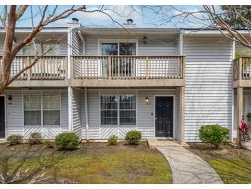 Charming townhome with a private balcony and well-maintained landscaping at 7814 Nummie Ct, North Charleston, SC 29418