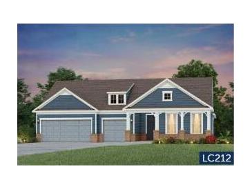 Charming single-Gathering home featuring blue siding, a covered porch, and a two-car garage at 125 Trillium Cir, Summerville, SC 29486