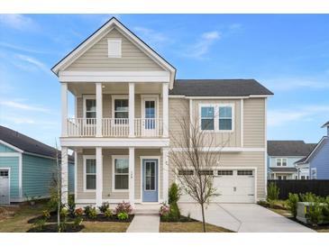 Charming two-story home with a welcoming front porch and manicured landscaping showcasing curb appeal at 190 Steepbrook, Summerville, SC 29486