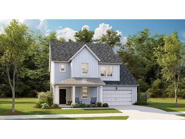 Charming two-story home with light blue siding, attached garage, and a welcoming front porch with rocking chairs at 198 Belfort Pl, Summerville, SC 29486