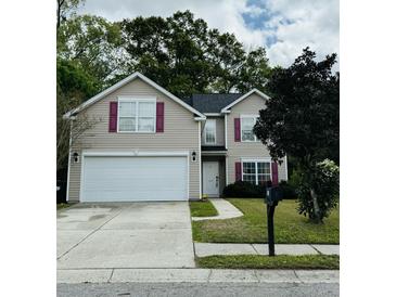 Charming two-story home with a well-maintained lawn, paved driveway, and traditional architectural details at 203 Arbor Oaks Dr, Summerville, SC 29485