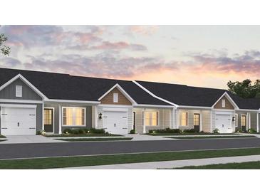 Charming single-Gathering homes feature attached garages, welcoming front porches, and well-manicured landscaping at 945 Dusk Dr, Summerville, SC 29486