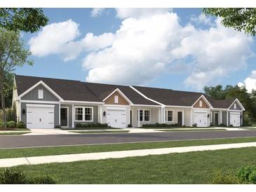 Charming townhomes featuring attached garages and professionally landscaped surroundings at 947 Dusk Dr, Summerville, SC 29486