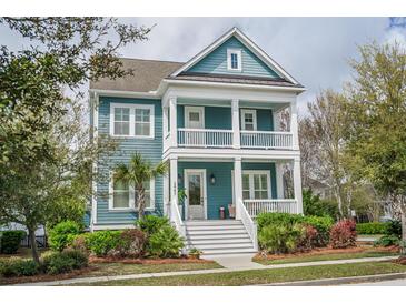 Charming two-story home featuring a spacious porch and a beautifully landscaped front yard at 2447 Louisville St, Charleston, SC 29492