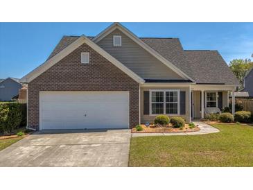 Charming single-Gathering home with a manicured lawn, a two-car garage, and a blend of brick and siding at 8208 Little Sydneys Way, North Charleston, SC 29406