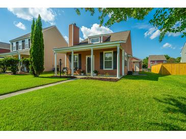 Charming home features a well-maintained front yard, porch, and inviting curb appeal at 226 Killarney Trl, Moncks Corner, SC 29461