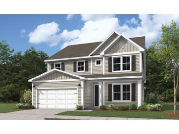 Charming two-story home with a gray exterior, a two-car garage, and a well-manicured lawn at 349 Wappoo Trace Ln, Summerville, SC 29486