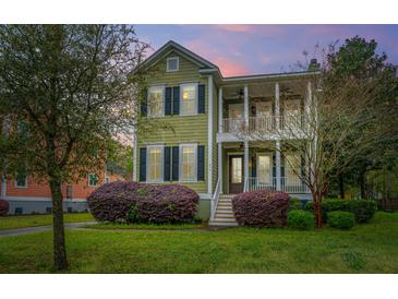 Charming two-story home with a double porch and beautifully landscaped front yard at 835 Hale St, Charleston, SC 29412