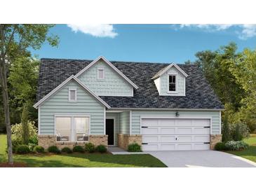 Charming single-Gathering home featuring a 2-car garage, manicured lawn and light siding at 1159 Darling St, Summerville, SC 29485