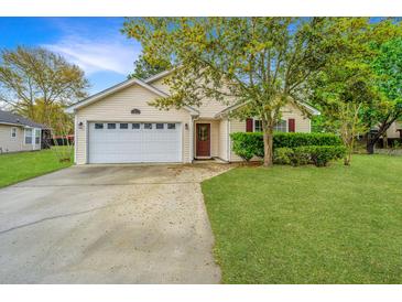 Inviting home with a well-manicured lawn and a two-car garage at 1312 Belle Grove Cir, Hanahan, SC 29410