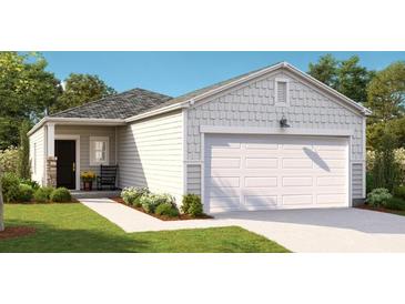 Charming single-story home featuring a manicured lawn and a two-car garage at 314 Tiliwa St, Summerville, SC 29486