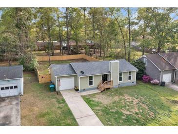 Ranch style home featuring an attached garage, a new fence, and a landscaped front yard at 109 Sawmill Dr, Summerville, SC 29483