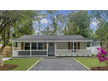 Charming single-story home with a welcoming front porch and neatly landscaped front yard at 1133 Mount Batten Dr, Hanahan, SC 29410
