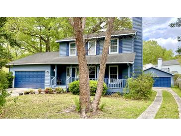 Charming two-story home with a welcoming front porch, garage and beautiful blue siding at 1438 Arrow Wind Ter, Charleston, SC 29414