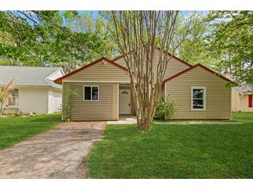 Charming single-story home featuring a well-maintained lawn and mature trees for curb appeal at 160 Mickler Dr, Ladson, SC 29456