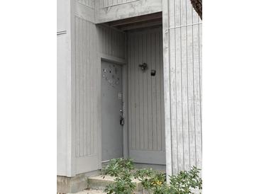 Unit front door with coded access in neutral painted wood building at 201 Greenmeadow Dr, Goose Creek, SC 29445
