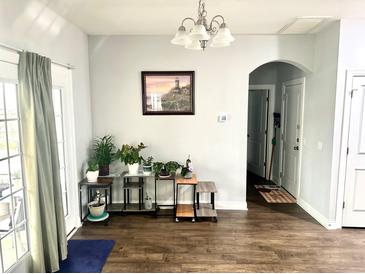 Cozy dining area features a chandelier, hardwood floors, and decor at 565 Mountain Laurel Cir, Goose Creek, SC 29445