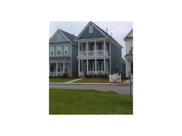 Charming two-story home with a double porch, perfect for enjoying outdoor living at 102 Dandelion St, Summerville, SC 29483