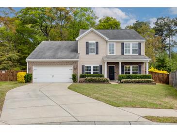 Charming two-story home with a well-manicured lawn, attached garage, and inviting curb appeal at 1996 Wild Indigo Way, Hanahan, SC 29410