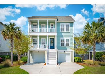 Inviting two-story coastal home with double porches, white trim, manicured lawn, and two-car garage at 1479 Mossy Branch Way, Mount Pleasant, SC 29464