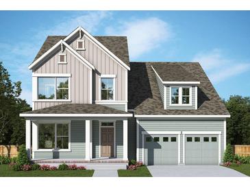 Charming two-story home featuring a two-car garage, covered porch, and beautiful light-colored siding at 211 Clearpath Dr, Summerville, SC 29486