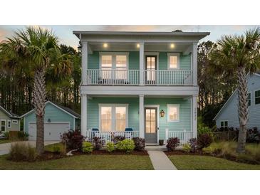 Inviting two-story home with double porches, palm trees, and lush landscaping at 2632 Private Lefler Dr, Johns Island, SC 29455