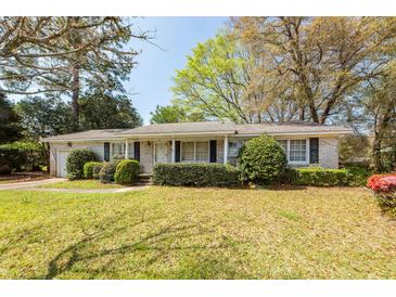 Charming single-story home featuring a manicured lawn and mature landscaping for enhanced curb appeal at 783 Dills Bluff Rd, Charleston, SC 29412